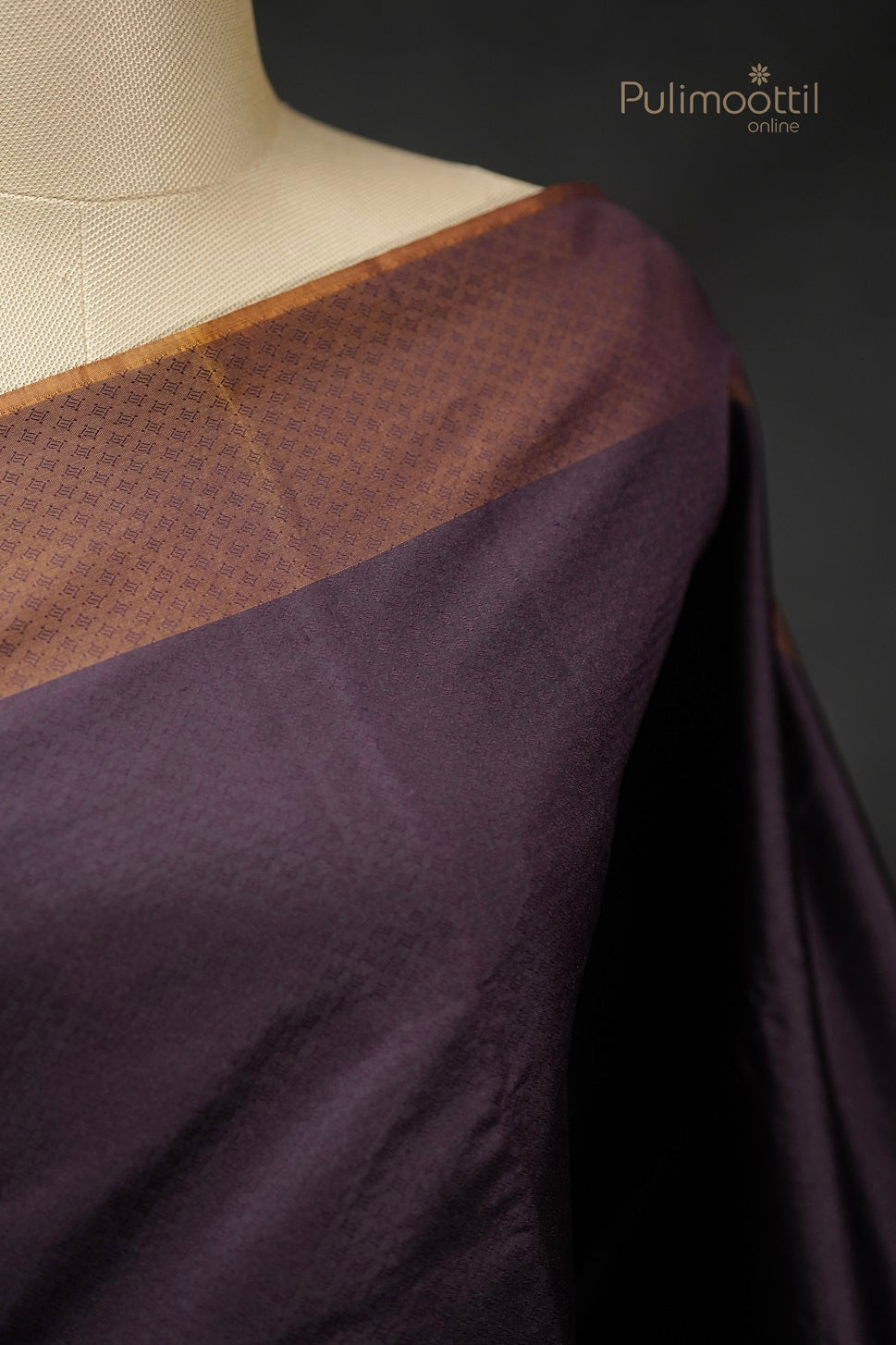 Detailed view of golden yellow self designer pallu on purple Kanchipuram saree