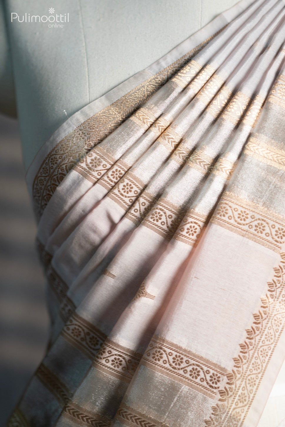 Bone cream colour organza saree.