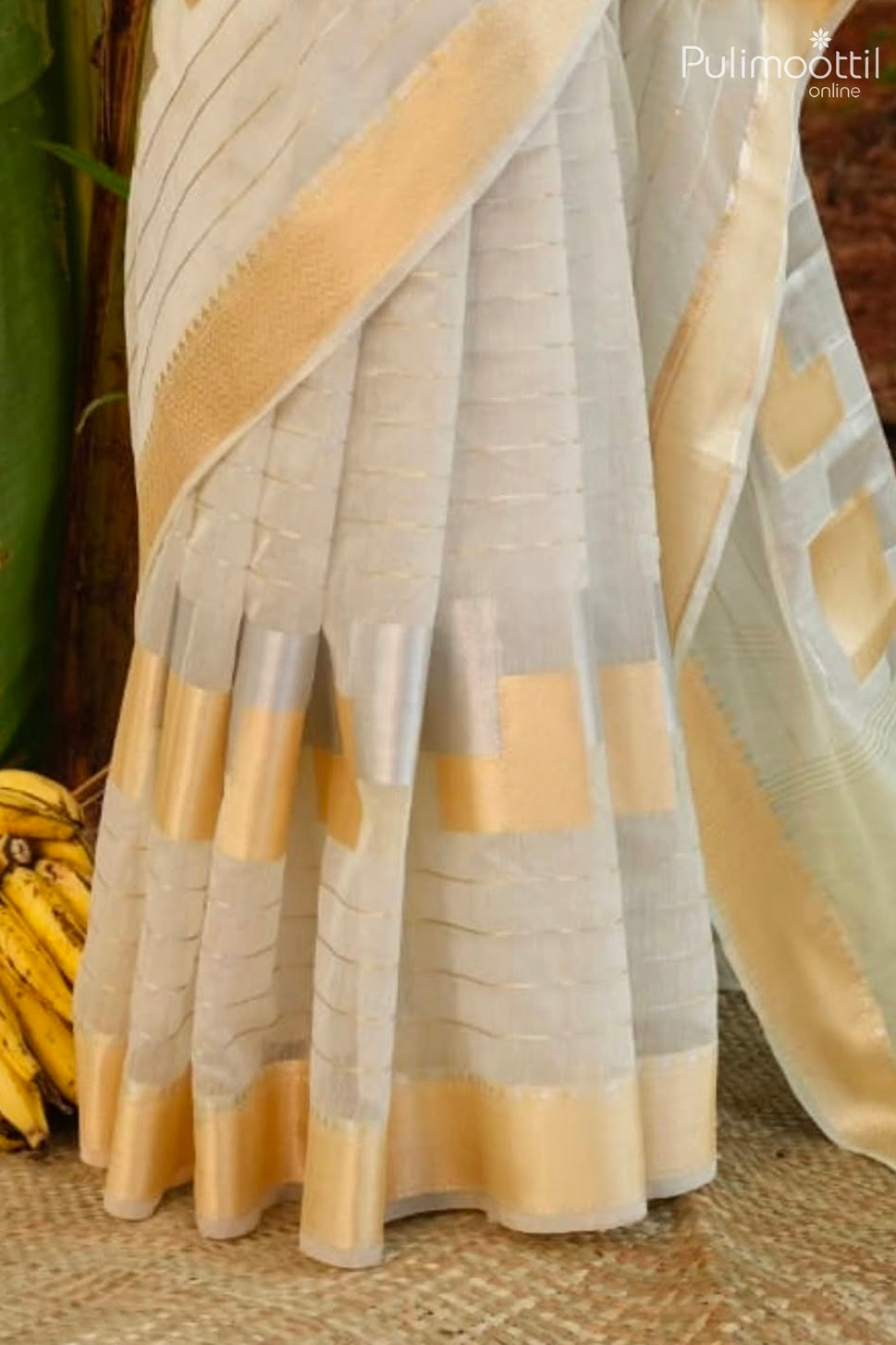 Offwhite color Kerala traditional Onam saree