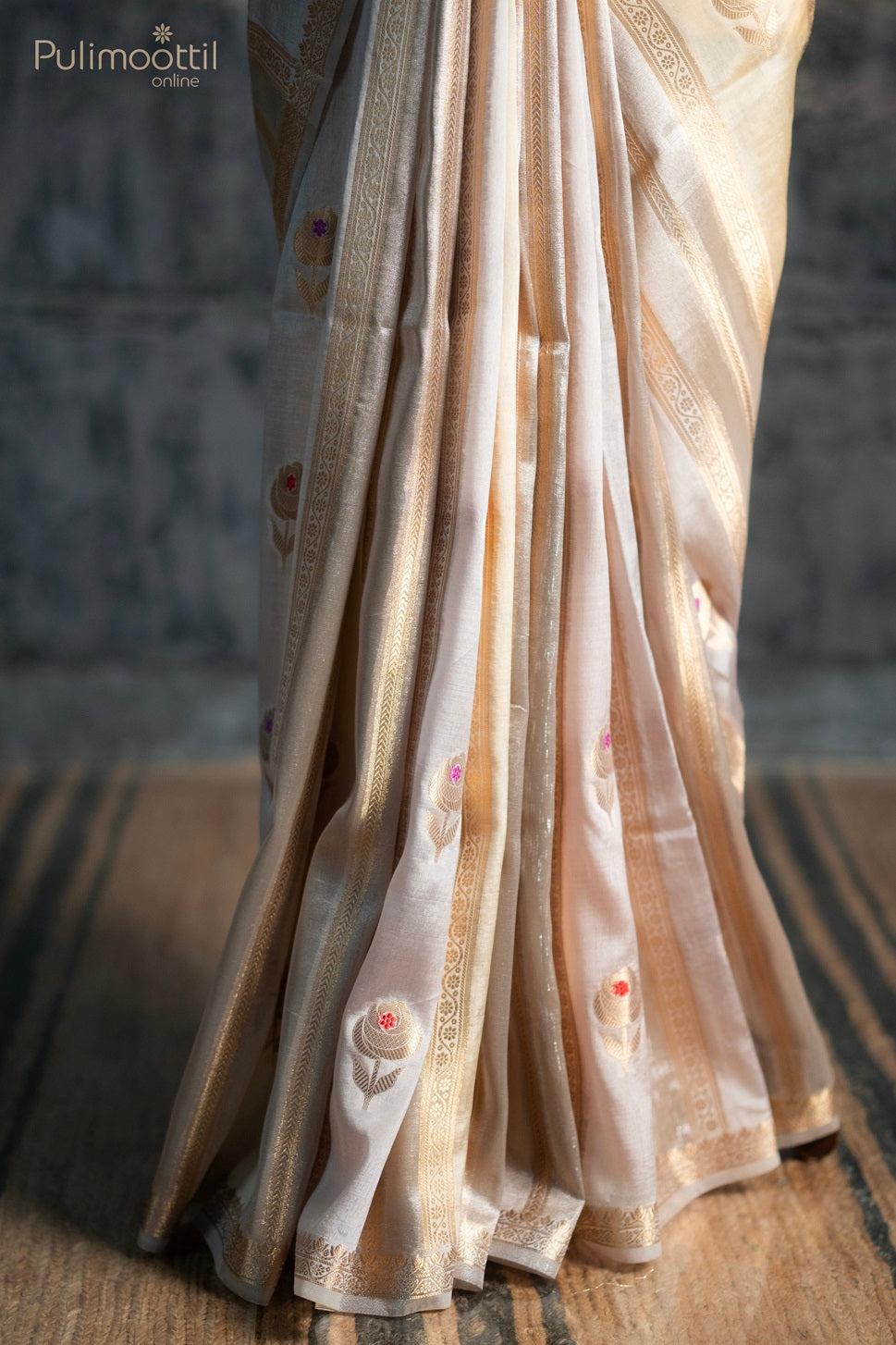 Bone cream colour organza saree.