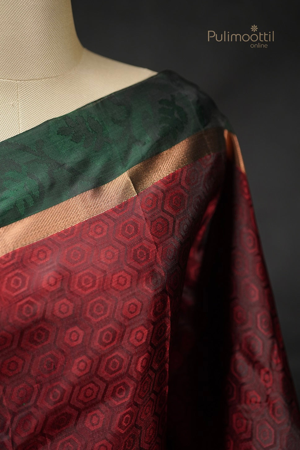 Close-up of maroon pentagon weave and green double border on Kanchipuram silk saree