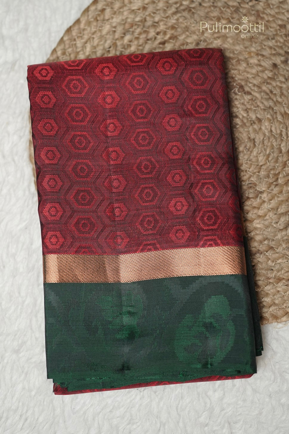 Folded maroon Kanchipuram silk saree with pentagon weave and green double border