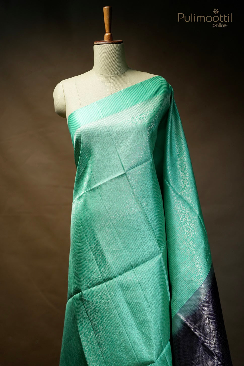 Mint green-colored Kanchipuram designer saree