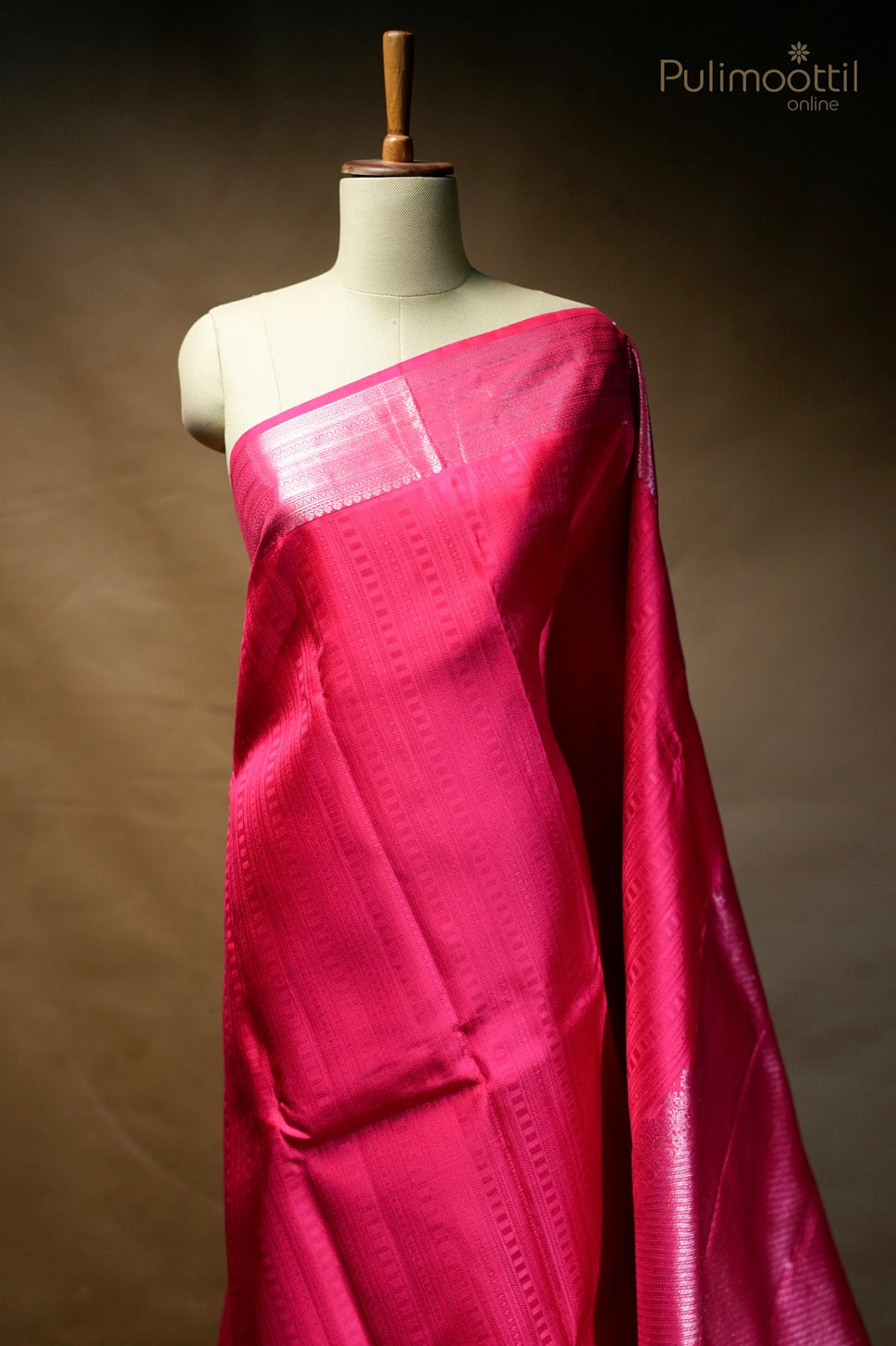 Rani pink-colored Kanchipuram self-print designer saree