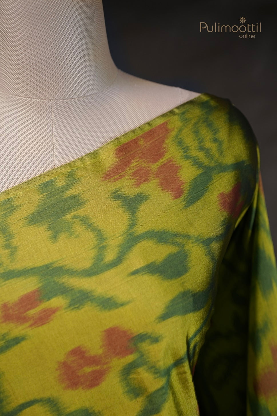 Close-up of Venom Green Ekath Print Saree with Floral Design and Maroon Border on Shoulde