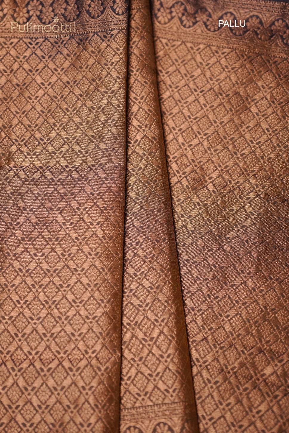 Detailed view of golden yellow self designer pallu on purple Kanchipuram saree