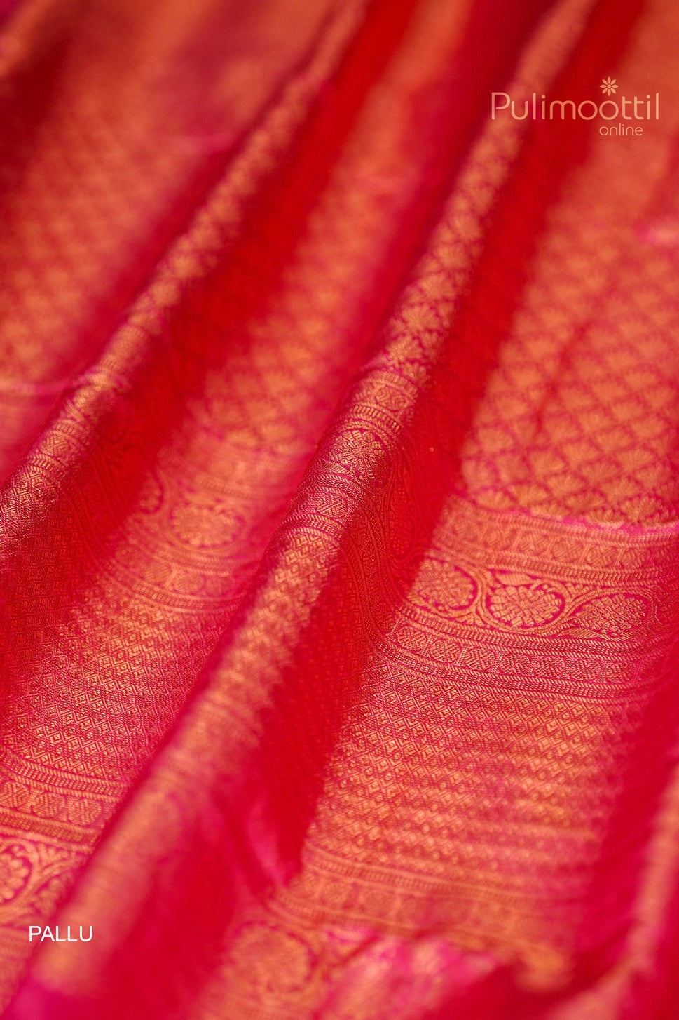 Detailed view of the contrast pallu with intricate weaving in melon colour semi Kanchipuram saree.
