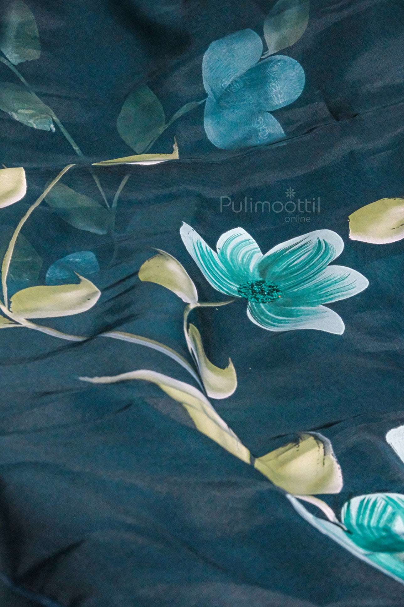 Peacock blue soft organza saree with hand-painted floral design and subtle green leaves
