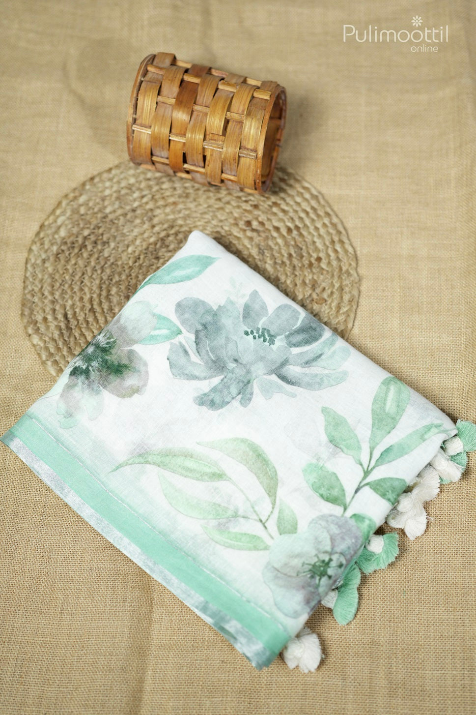 Off-white colored printed linen saree