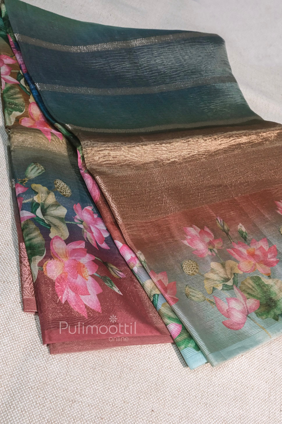 Entire view of the saree draped in layers, showcasing the gradient of rainbow shades and floral design.