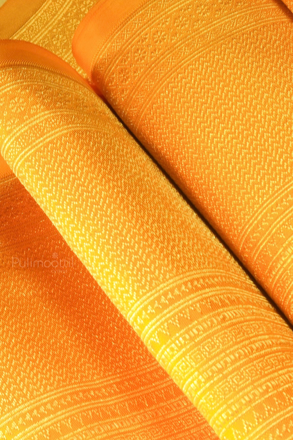 Rolled view of Kanchipuram bridal saree highlighting fine weave and zari finish