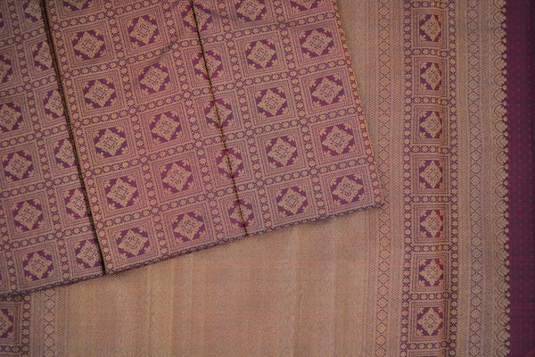 Maroon colour kanchipuram brocade saree.