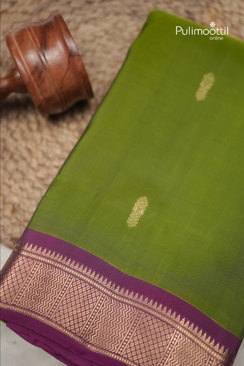 Olive Green Kanchipuram Silk Saree with Contrast Border.