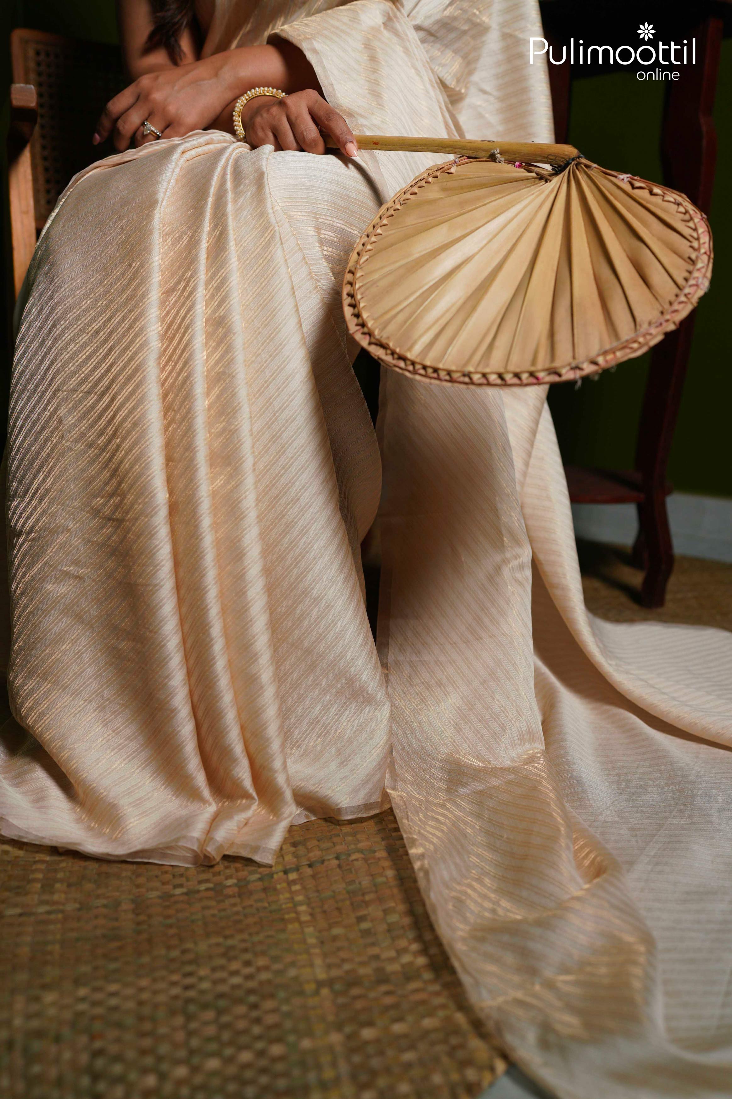 Cream and gold  Colour Light weight Brocade Saree.