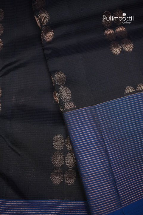 Dark Navy Blue Kanchipuram Silk Saree with Copper Butta and Contrast Borders.