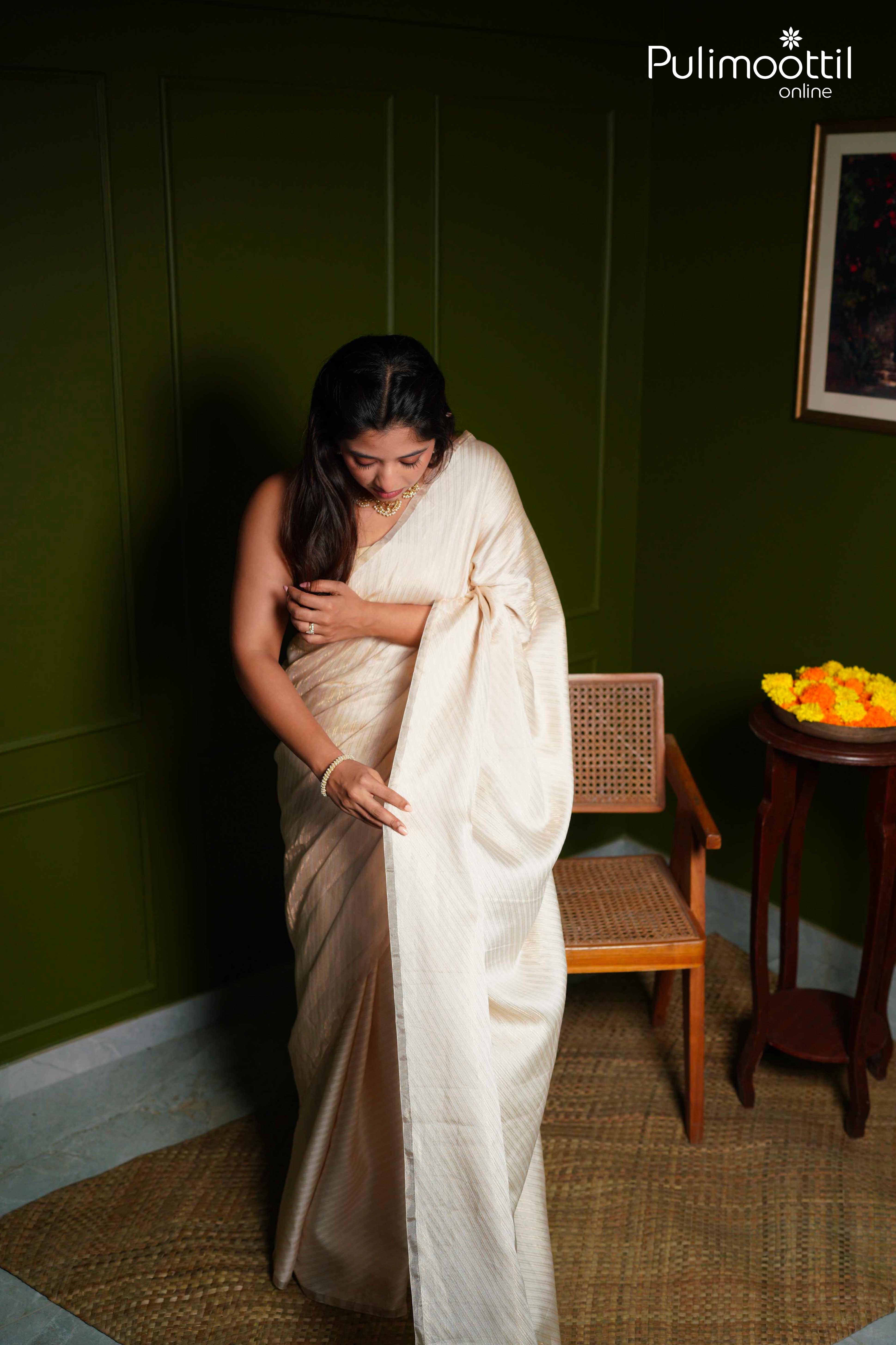 Cream and gold  Colour Light weight Brocade Saree.
