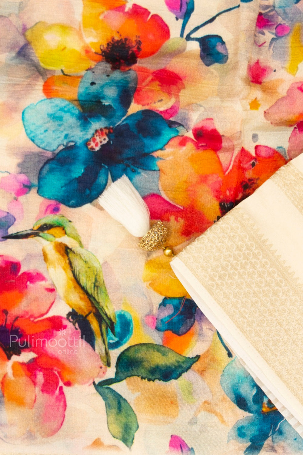 Close-up of Multicolor Floral Printed Kerala Saree with Bird Motif and Cream Zari Pallu – Elegant Festive Wear Fabric Design