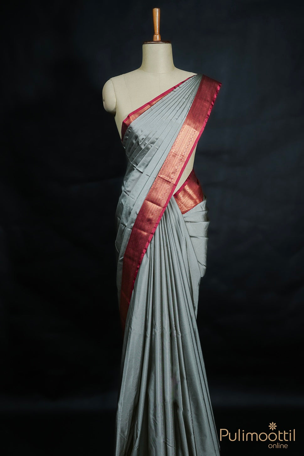“Ash colour Arni silk saree draped on mannequin showing plain body and contrast maroon designer border