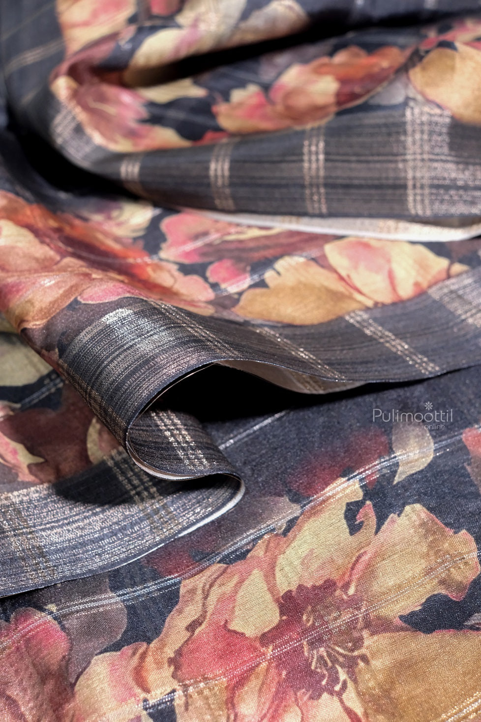 Front view of a black semi tussar silk saree draped on a mannequin, showcasing its elegant texture and traditional weave.