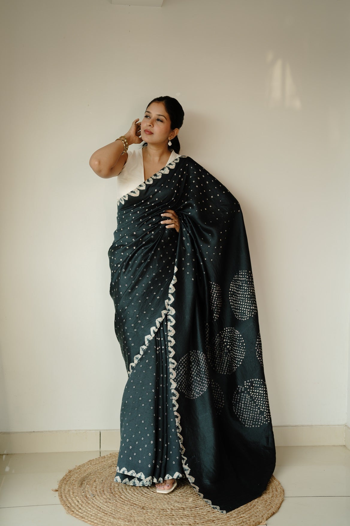 Black and white pure tussar bandhini saree with traditional tie-dye pattern and mirror work, elegant Indian ethnic wear