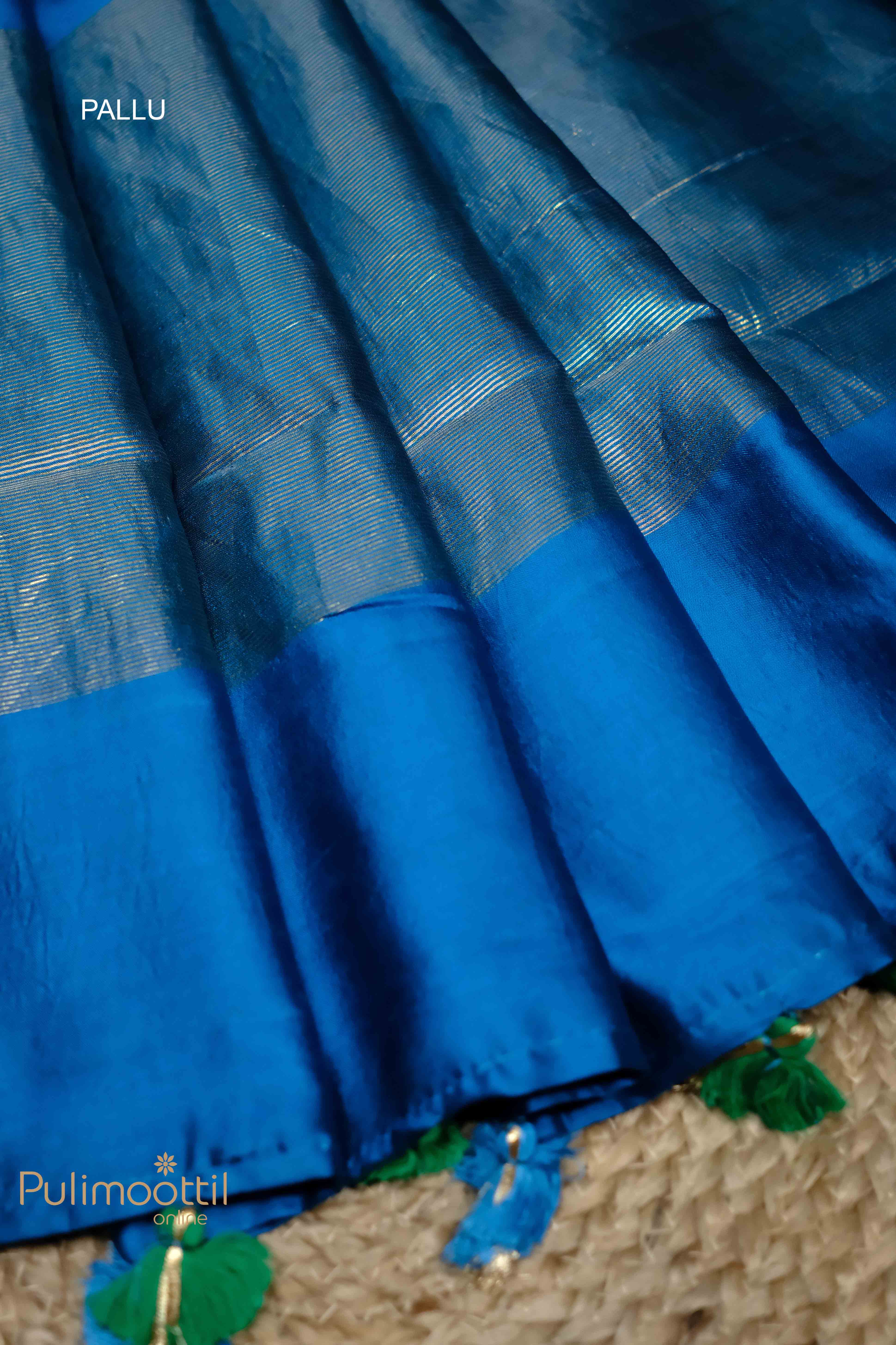 Full view of the blue Chiniya Silk Saree with golden floral motifs and a floral body design