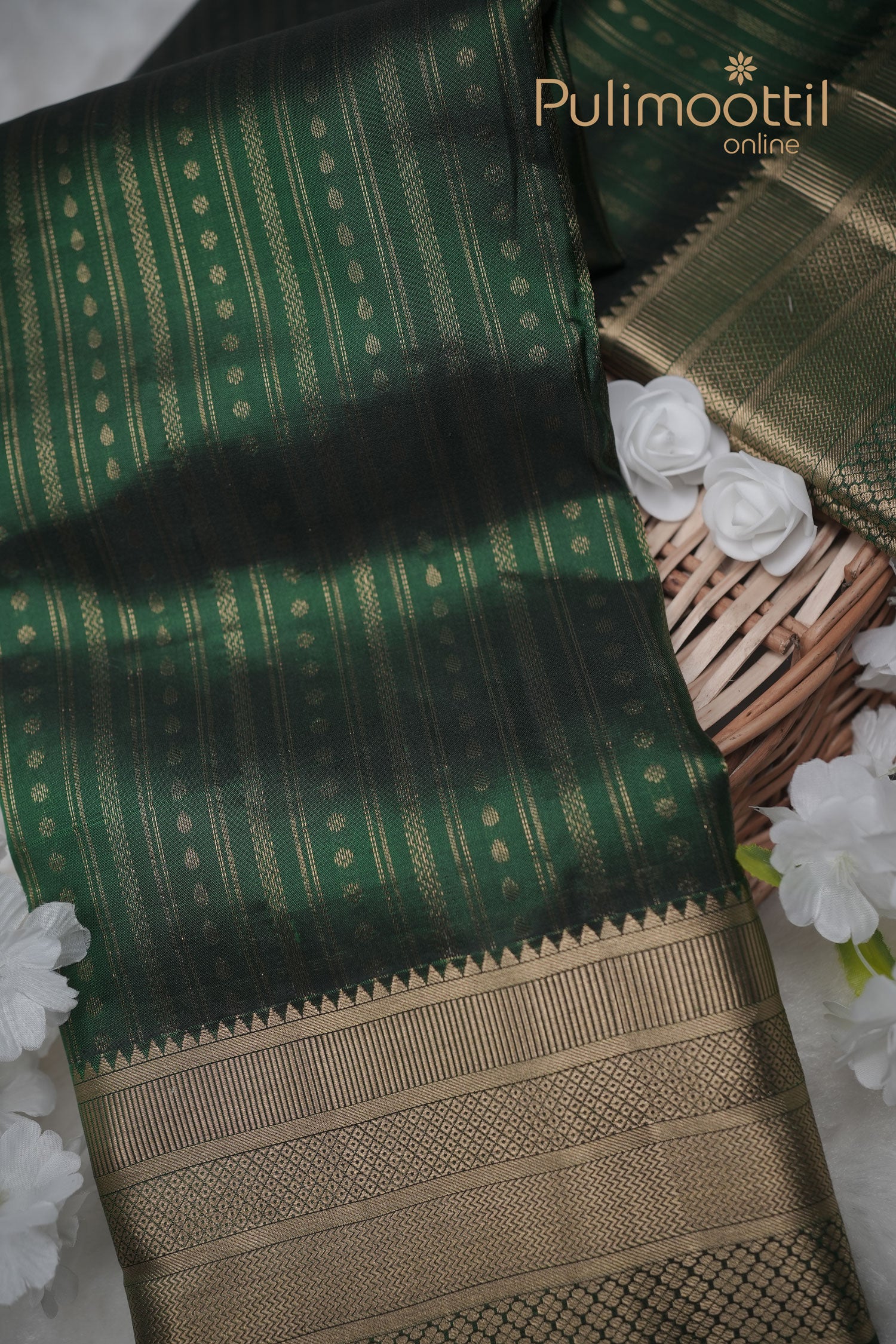 Bottle‑green Kanchipuram silk saree with golden zari stripes and small butta motifs, Pulimoottil Online branding