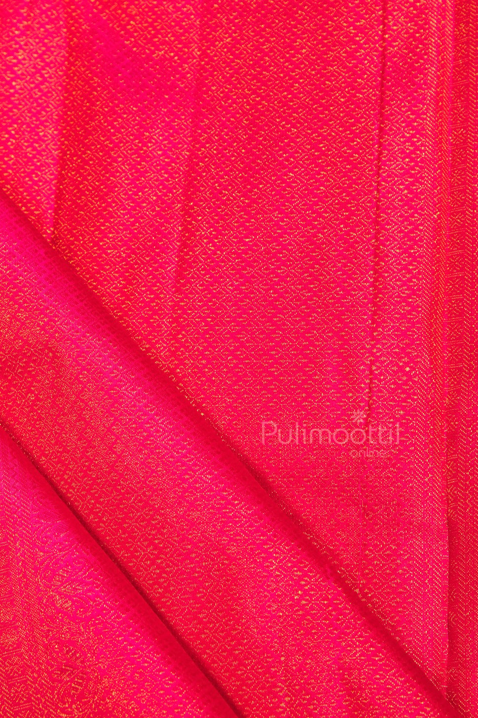 Close-up of ripe plum blouse fabric with dense gold zari minute diamond weave, complementing bridal saree