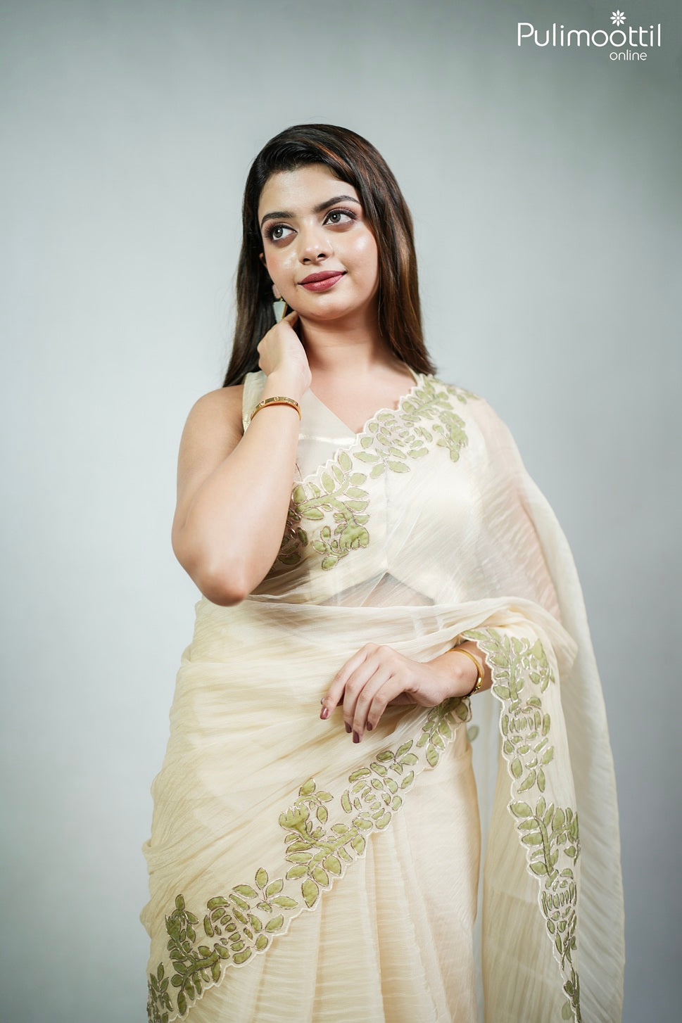 Ivory color crushed organza fancy saree