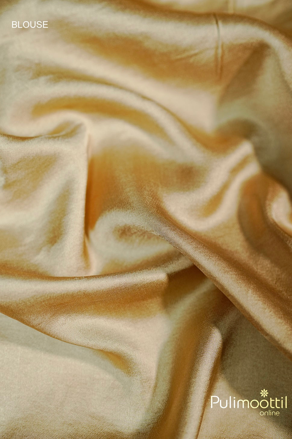 Close-up of golden satin blouse fabric, smooth texture with a lustrous finish.
