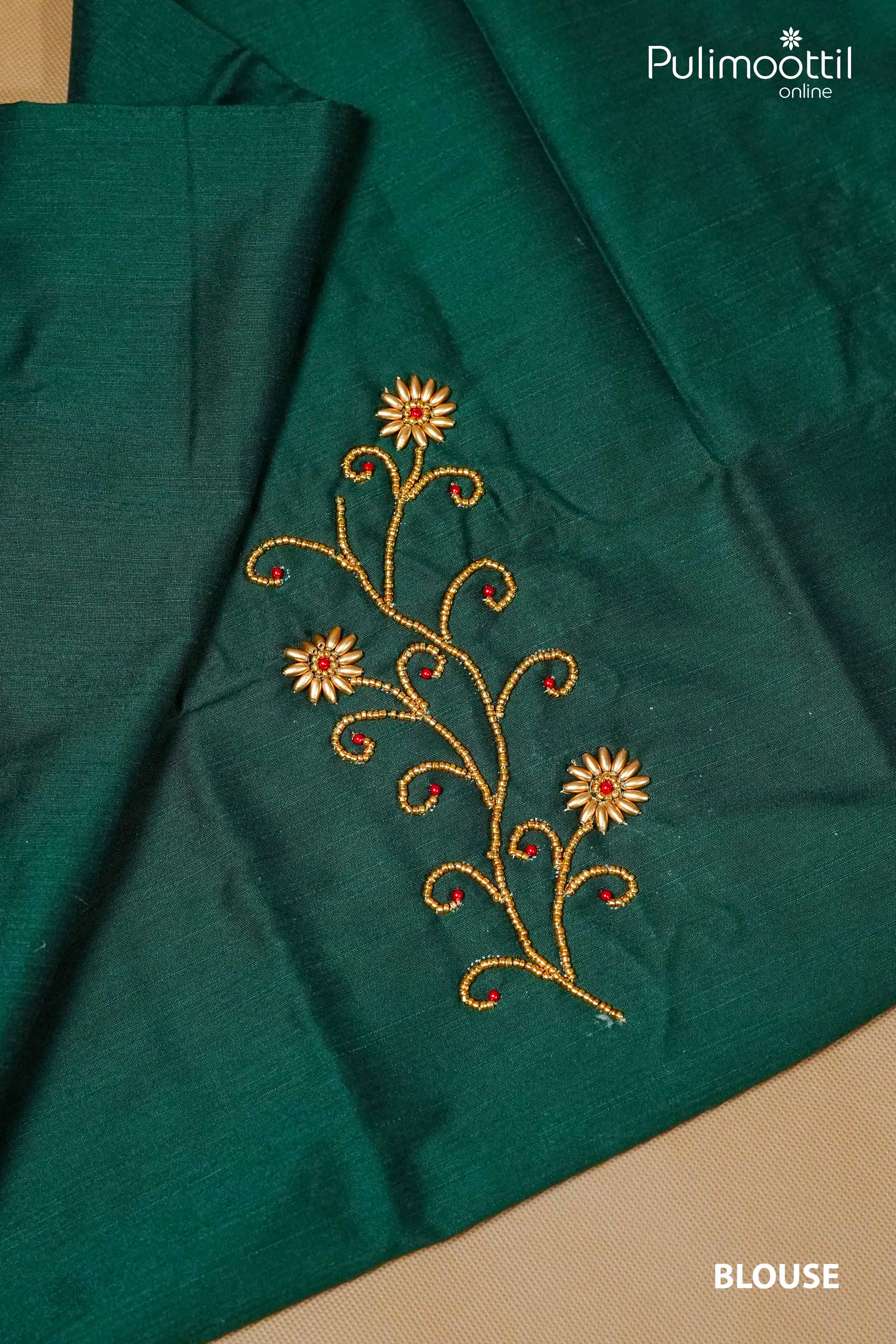 Dark green blouse piece with golden bead floral embroidery and red stone accents, designed to match Kerala set saree