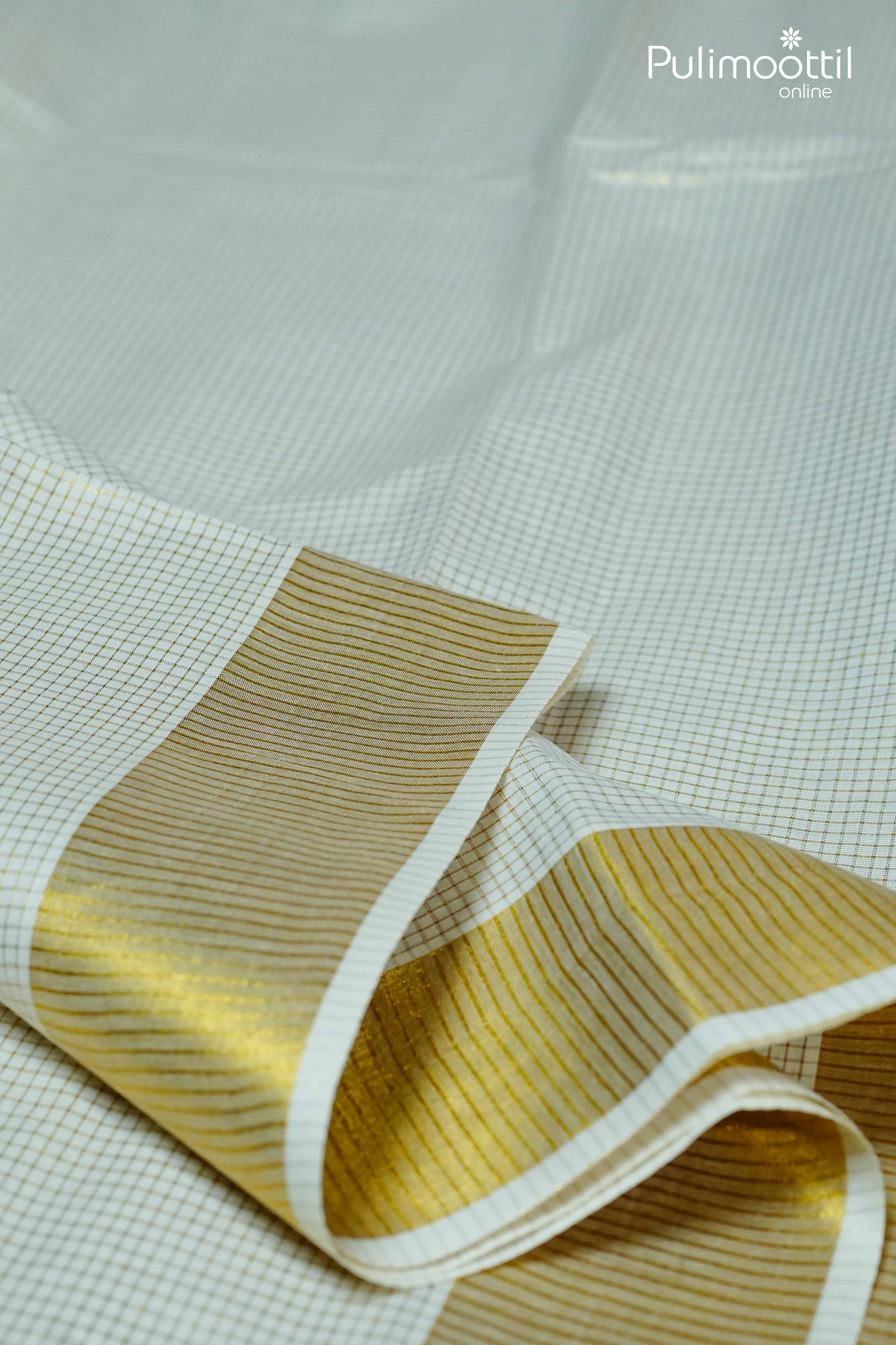 Golden zari tissue border detail on cream Kerala set saree with fine grid check pattern
