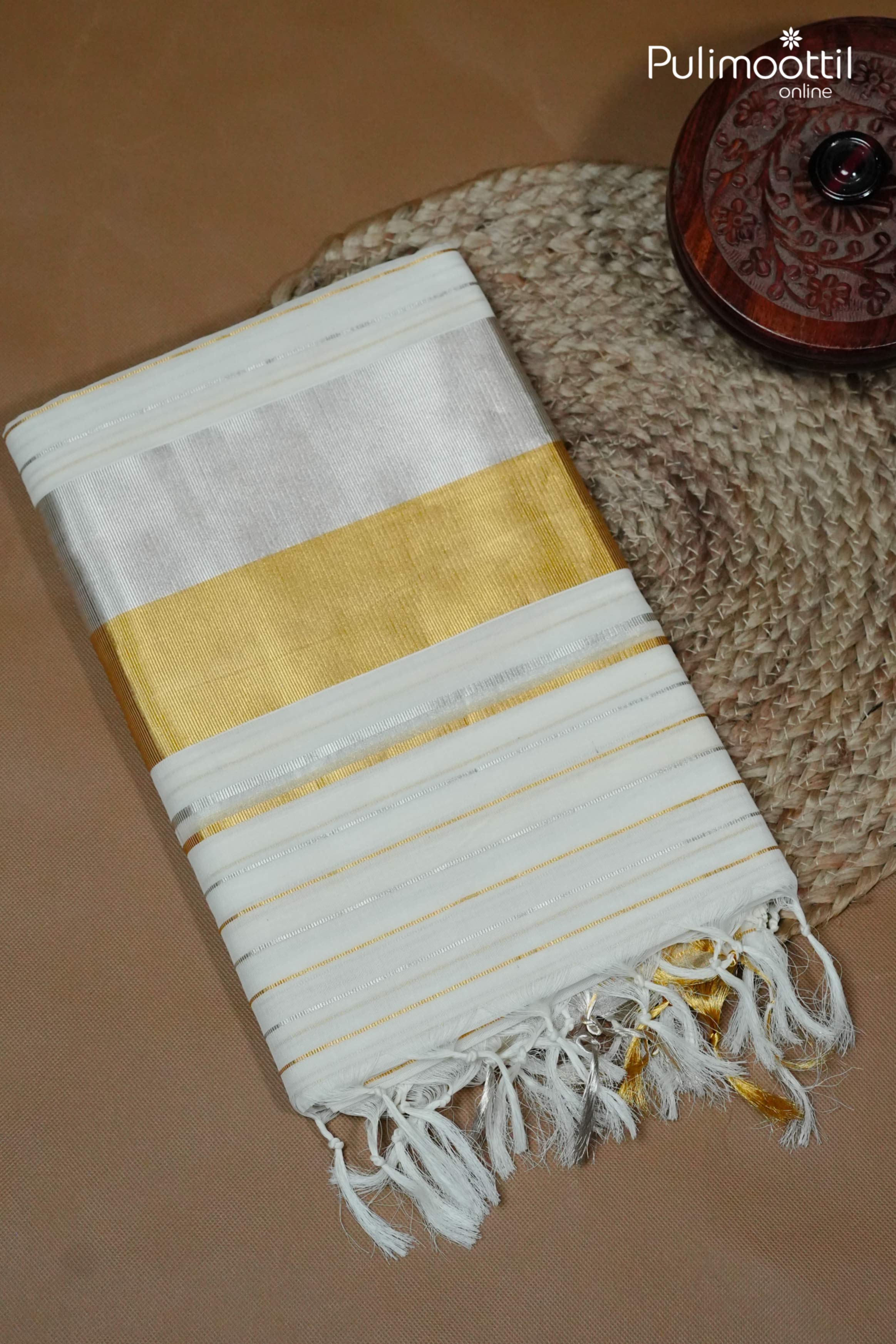 Folded cream Kerala set saree with mixed golden and silver tissue border, zari stripe design, and tasselled pallu