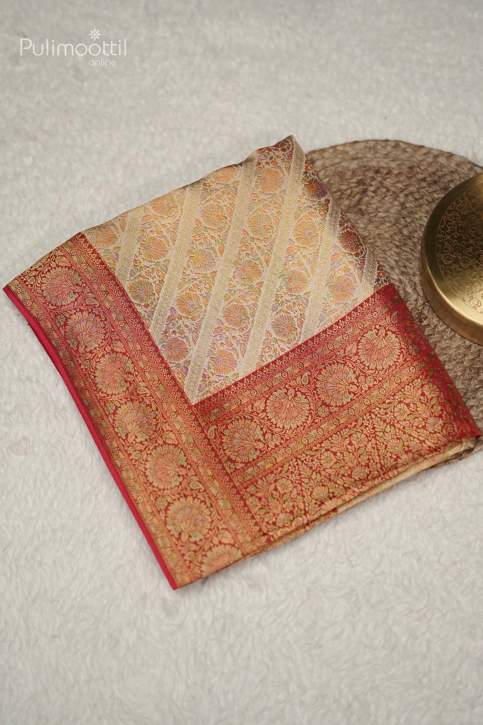 Folded pastel multishaded organza fancy saree with broad stripes, golden buttas, and vertical striped border, elegant choice for bridal and party wear.