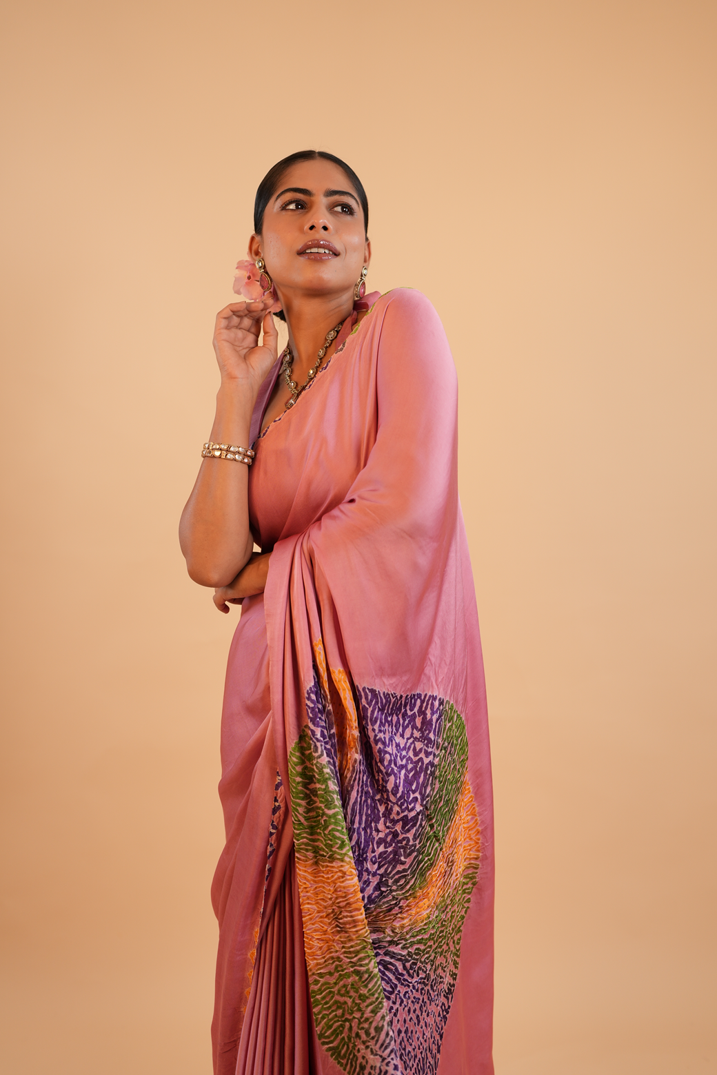 Peach-colored Shibori work modal silk saree