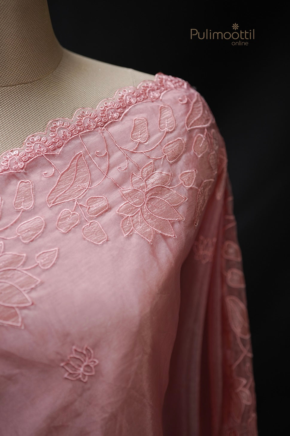 Peach organza saree set with small lotus embroidery and lotus cut work scallop border, elegant bridal and wedding saree from Pulimoottil Silks Thrissur.
