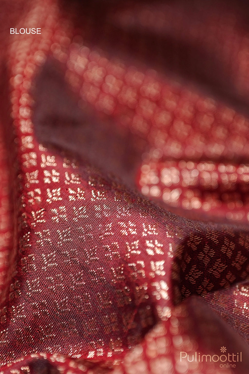 Dark maroon Kanchipuram brocade wedding saree blouse piece with antique zari small floral weaving close-up