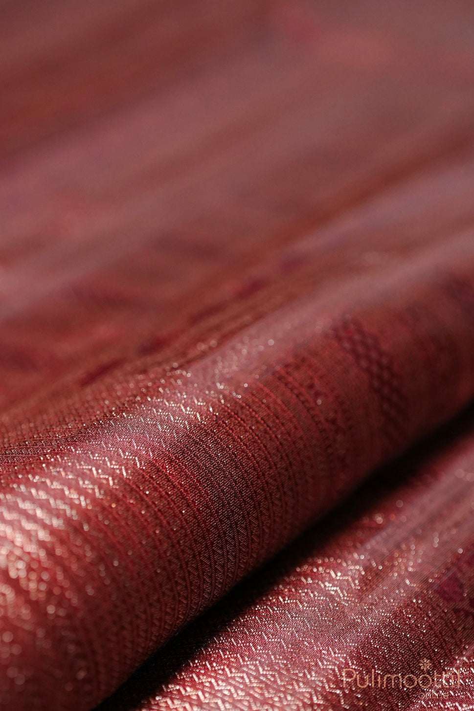 Dark maroon Kanchipuram brocade wedding saree body with antique zari stripes and intricate weaving close-up