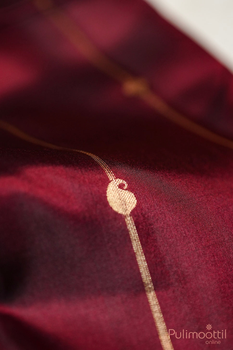 Dark Maroon Colour Kanchipuram Silk Saree. Golden Buttas And Stripes On Body With Golden Zari Border.