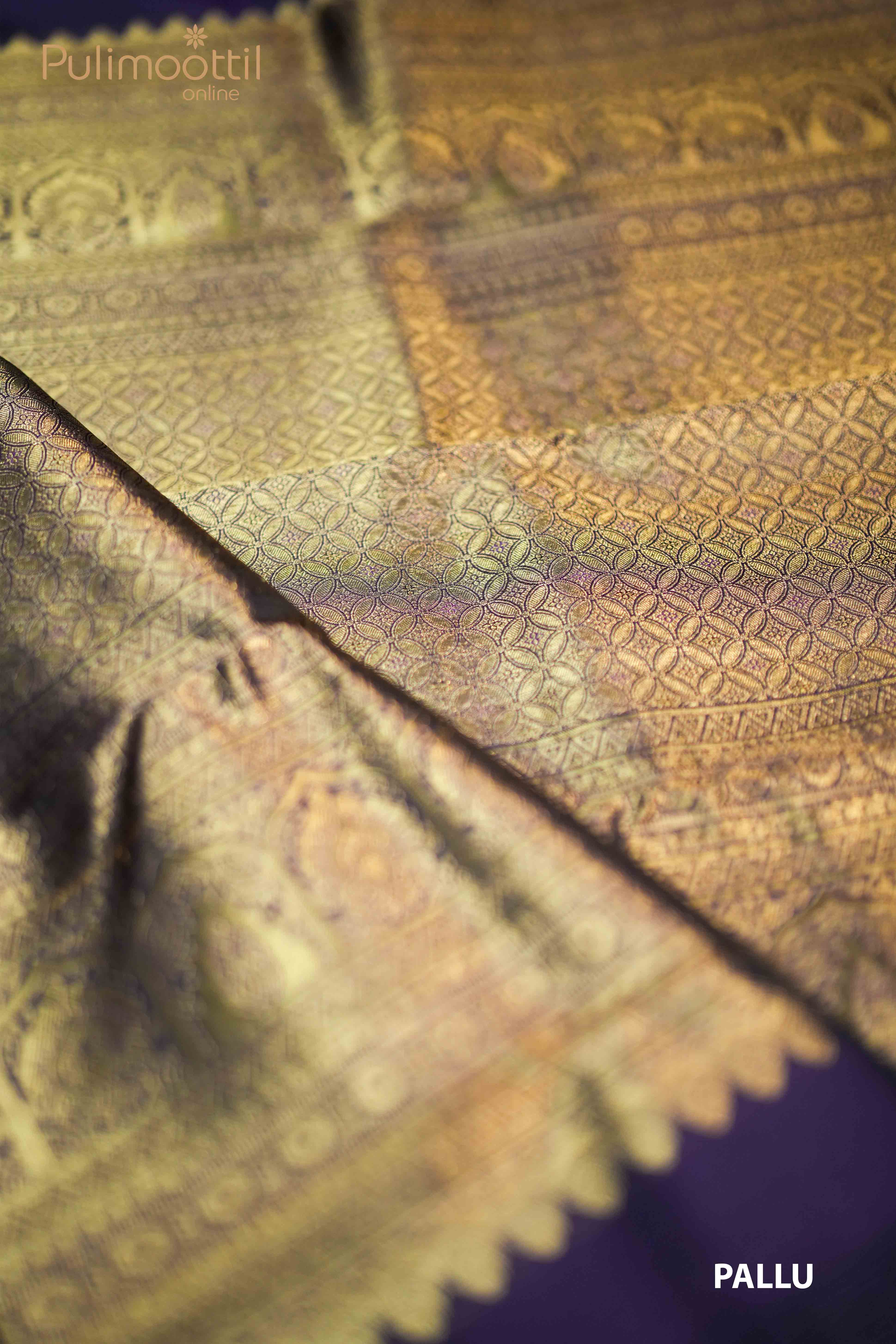 Rich purple silk blouse fabric with a golden zari border, part of a traditional Kanchipuram saree from Pulimoottil