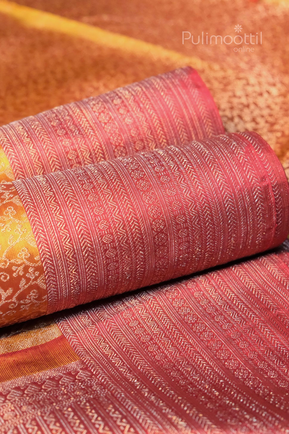 Dijon yellow pure Kanchipuram silk brocade saree with red-pink border showing traditional weaving patterns