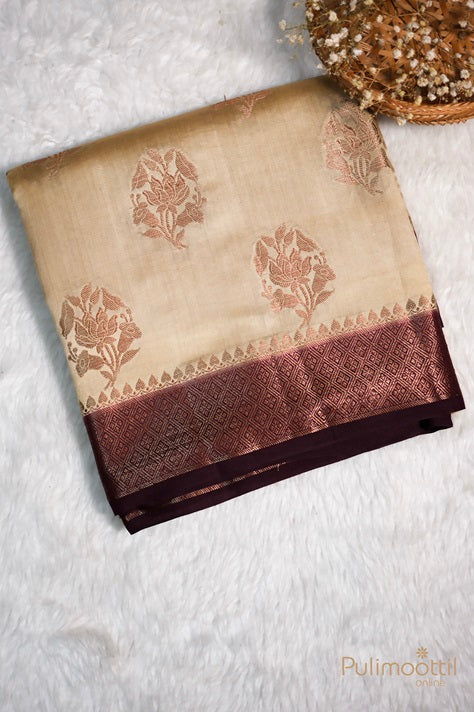 Folded Ecru beige Chiniya Banarasi silk saree with maroon geometric Banarasi thread border and floral motifs, placed on a white textured background