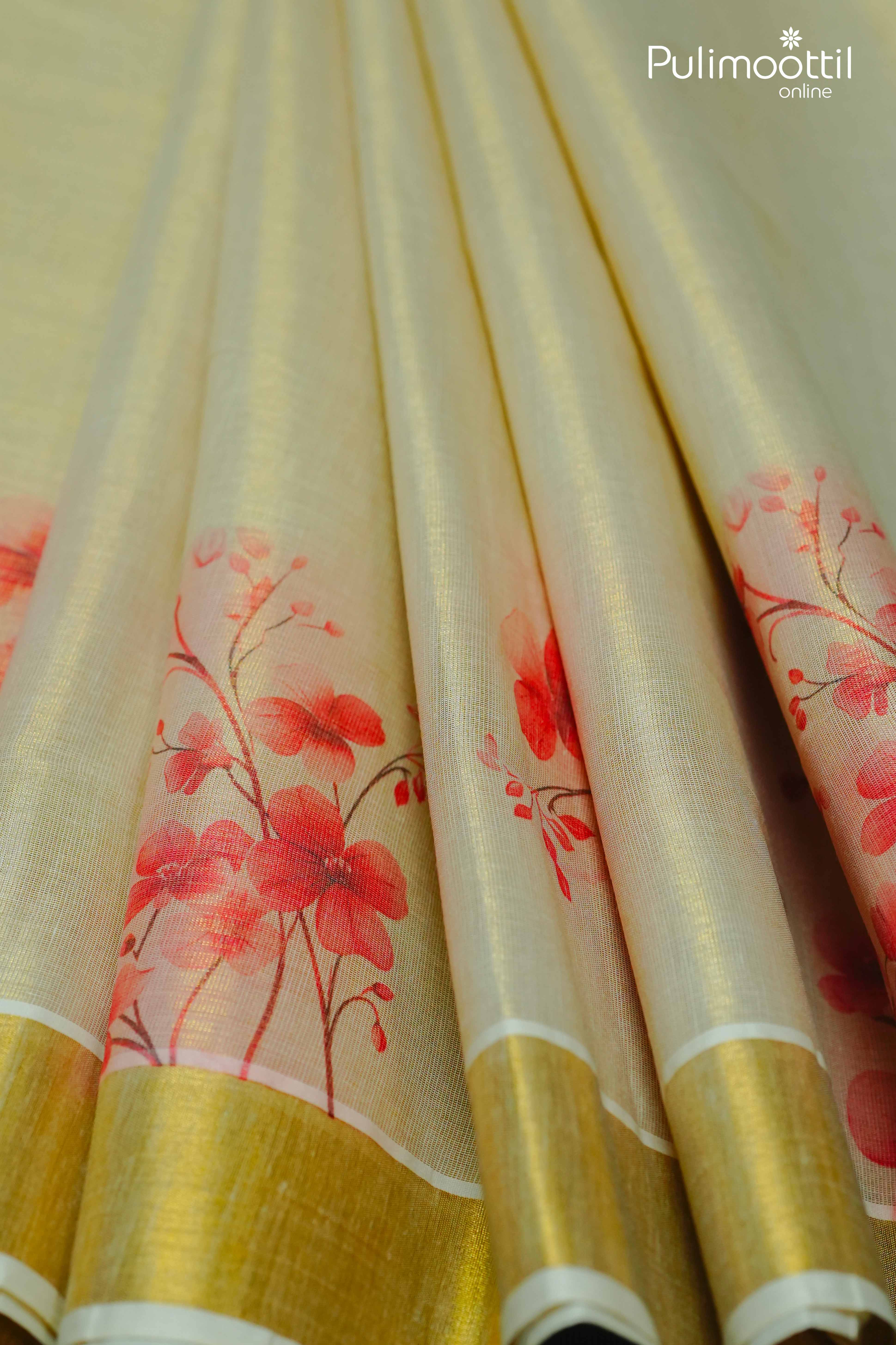 Pleated golden tissue saree with red floral print and lustrous gold border – Pulimoottil Silks