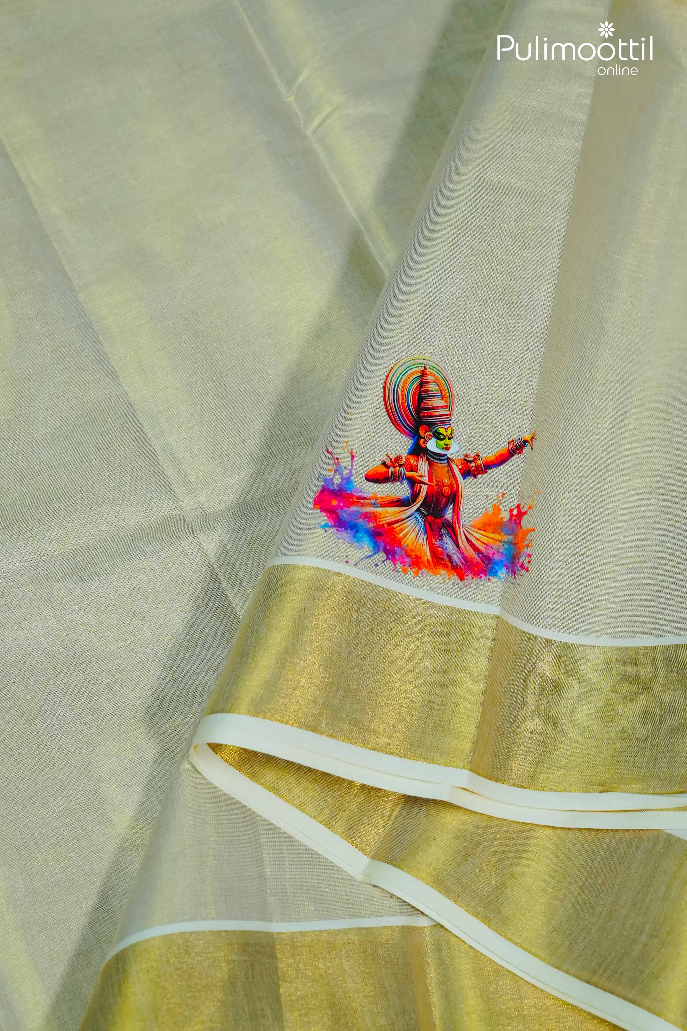 Cream‑gold Kerala tissue saree pallu draped to display vibrant Kathakali dancer digital prints above a gleaming golden kasavu border.