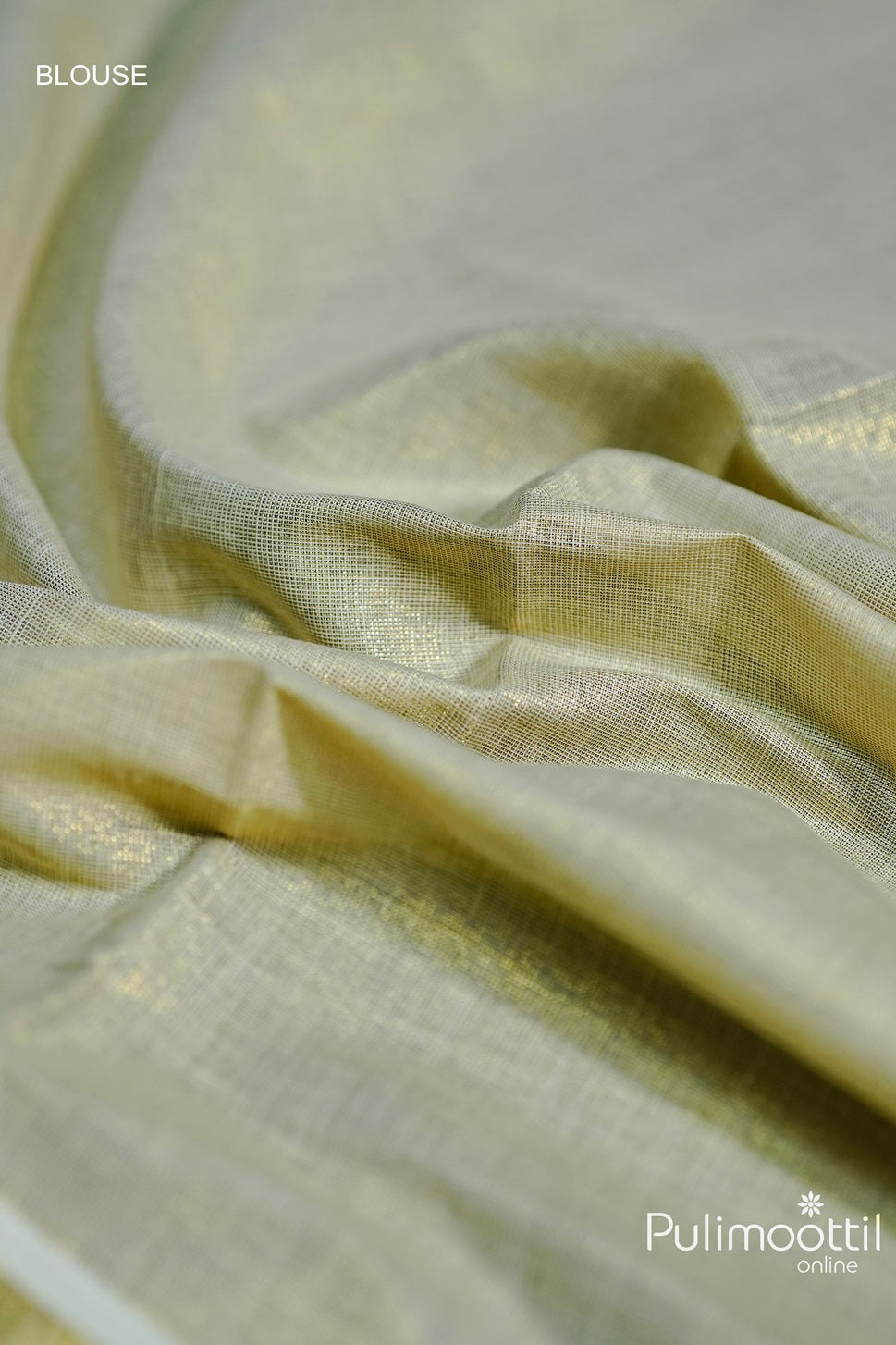 "Close-up of Golden Tissue blouse fabric with a soft, lustrous finish, complementing the Kathakali Mural Print Saree.