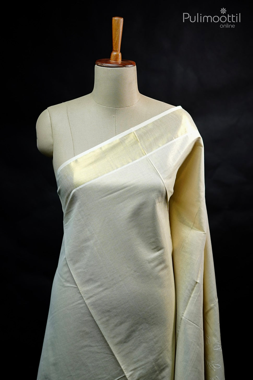 Golden tissue Kerala set saree with plain body and subtle thread work near border, displayed on mannequin