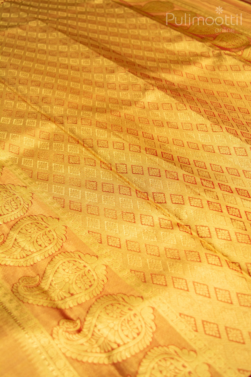 Kanchipuram tissue silk saree in gold with intricate red zari diamond motifs and traditional paisley border – ideal for weddings and festive occasions