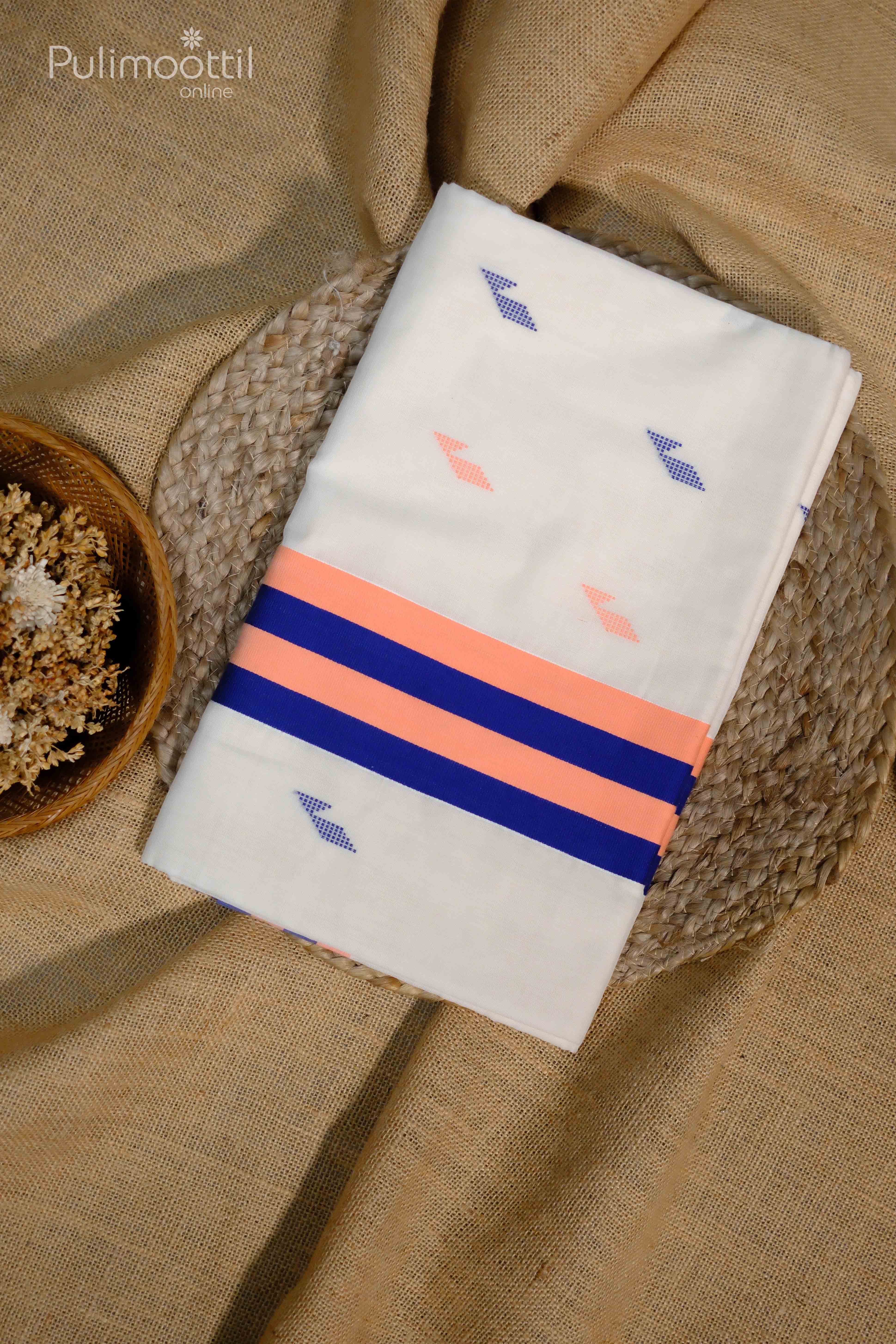 Folded Kerala traditional Onam set saree with mixed thread work, featuring peach and blue color striped border on an off-white base, placed on jute fabric

