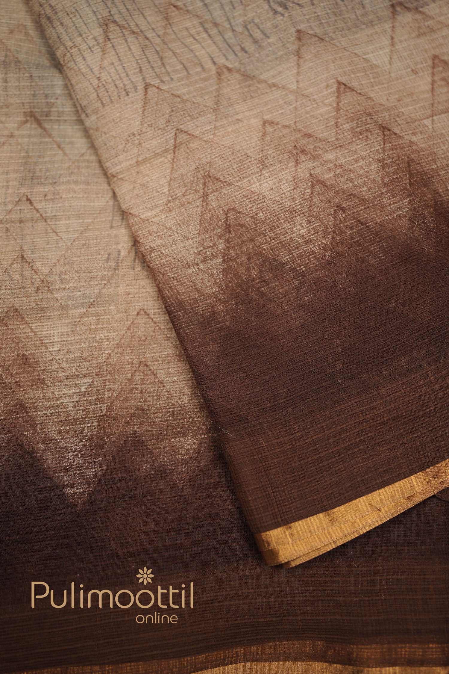 Multi-shaded soft net-cotton saree with intricate zigzag and line geometric patterns, finished with a golden border.