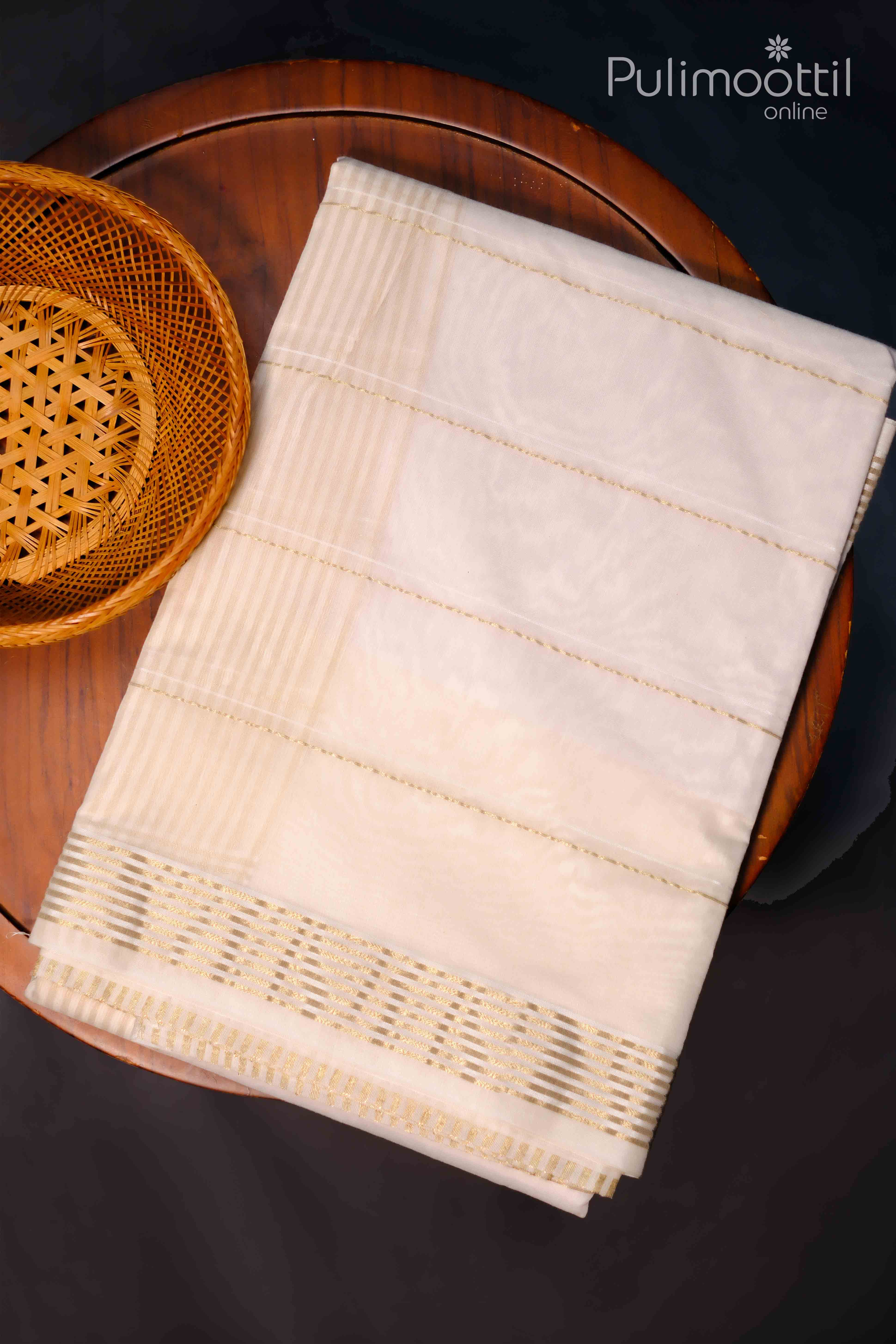 Traditional Kerala kasavu Saree with golden zari border, folded neatly on a wooden table, perfect for Onam celebrations.