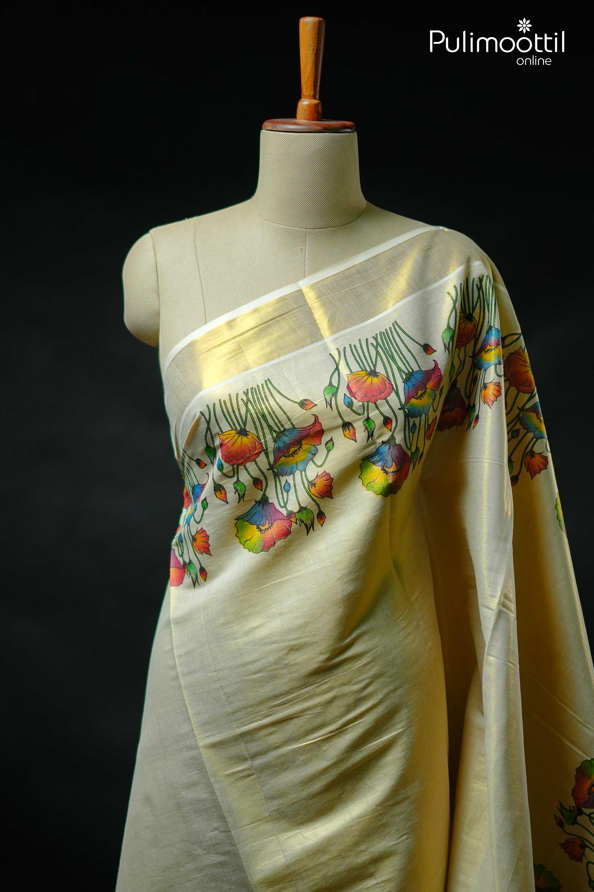 Off white Kerala set saree with colorful floral print on body and golden tissue border, paired with plain blouse and matching pallu – traditional Onam tissue saree.
